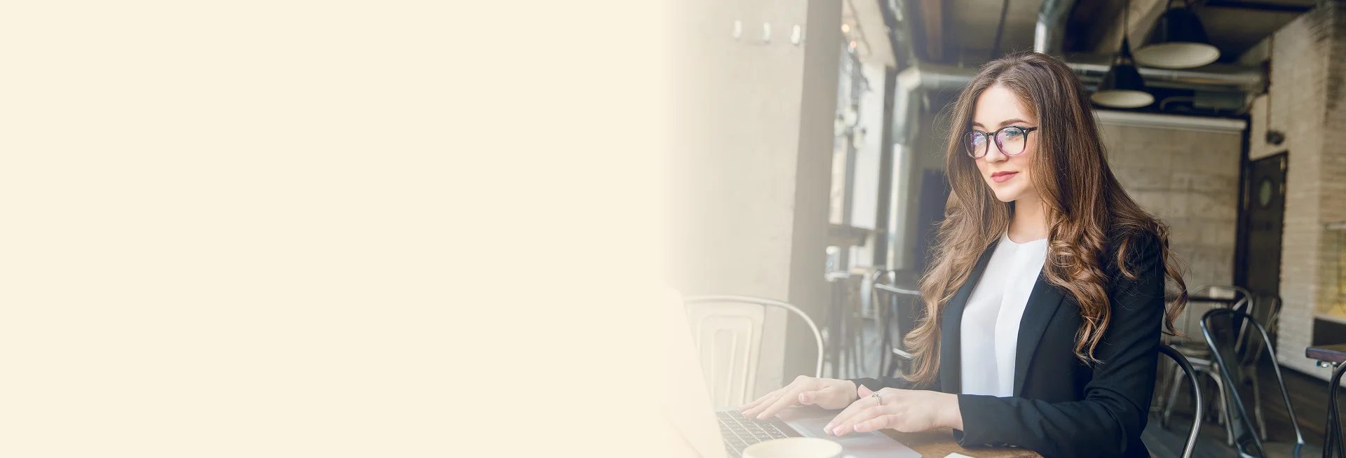 Professional using laptop for NAATI visa translation services